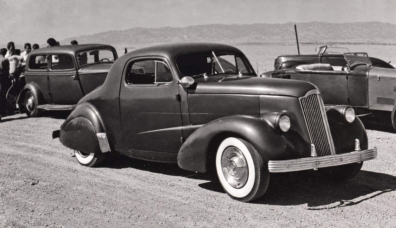 Leroy Semas’s Westergard-built ’37 Chevrolet coupe with its unchopped roof. Fassett’s original caption places the photograph at racing near Woodland.