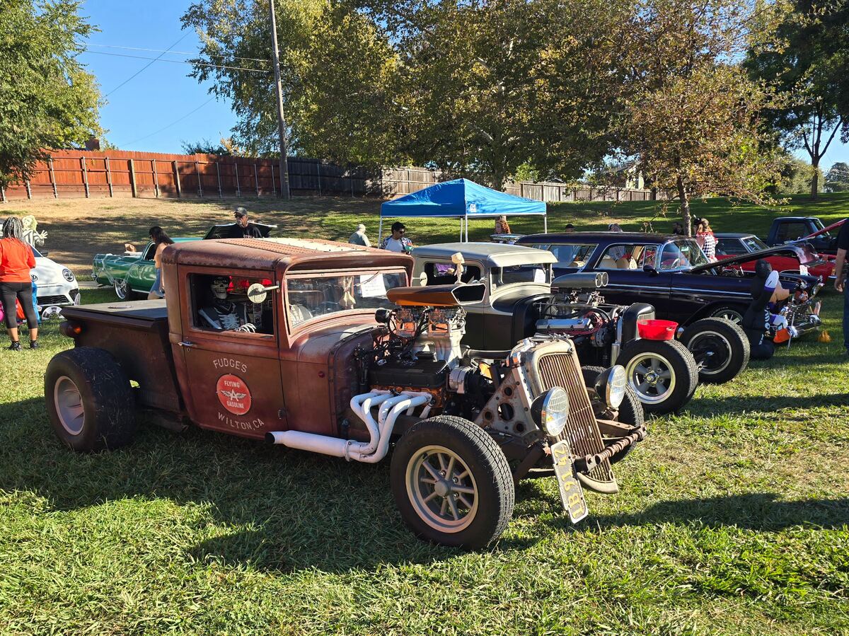 Weathered hot rod pickup among the cars at Rusch Park