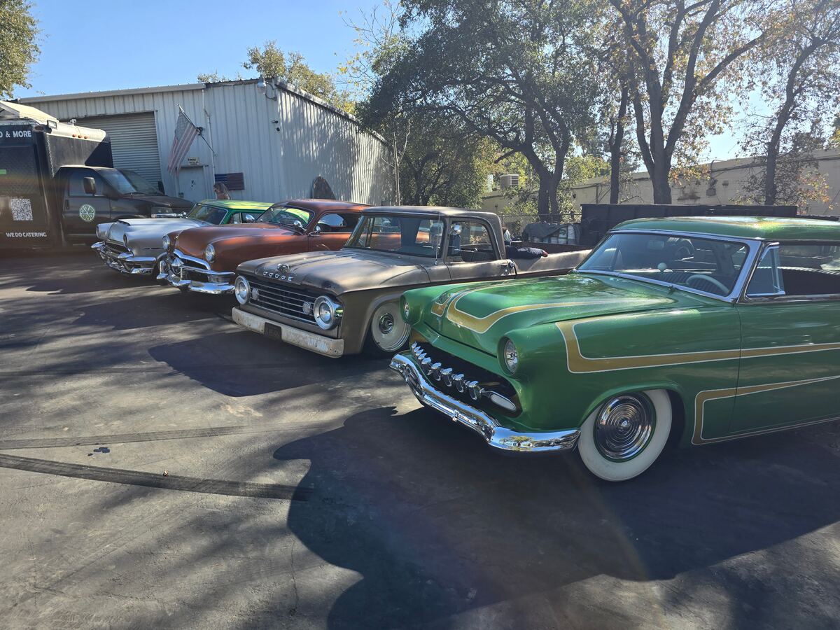 Green scalloped custom leading a row of cars at the Time Bombs Takeover