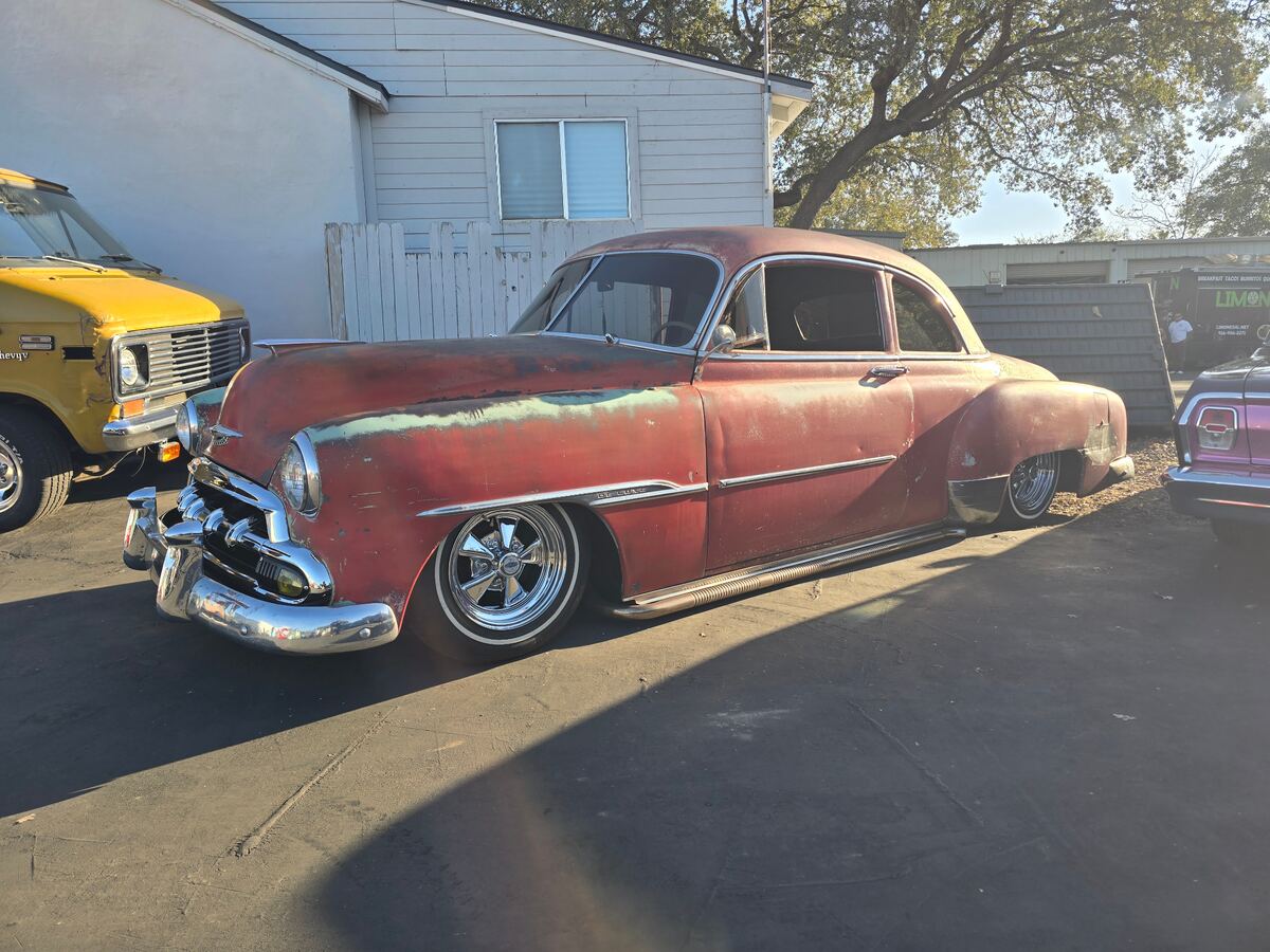 Weathered two-tone custom coupe with a low stance