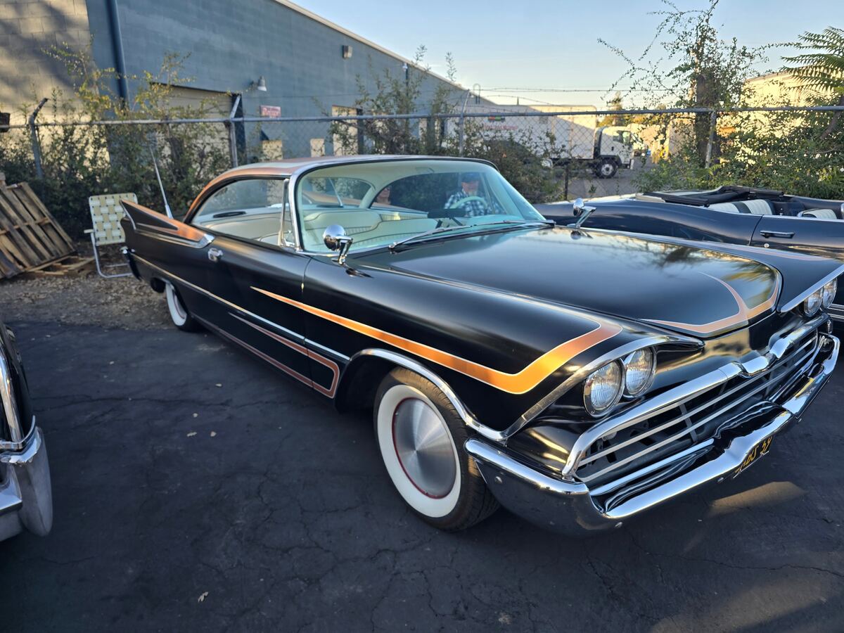 Black custom with gold accent paint and whitewall tires