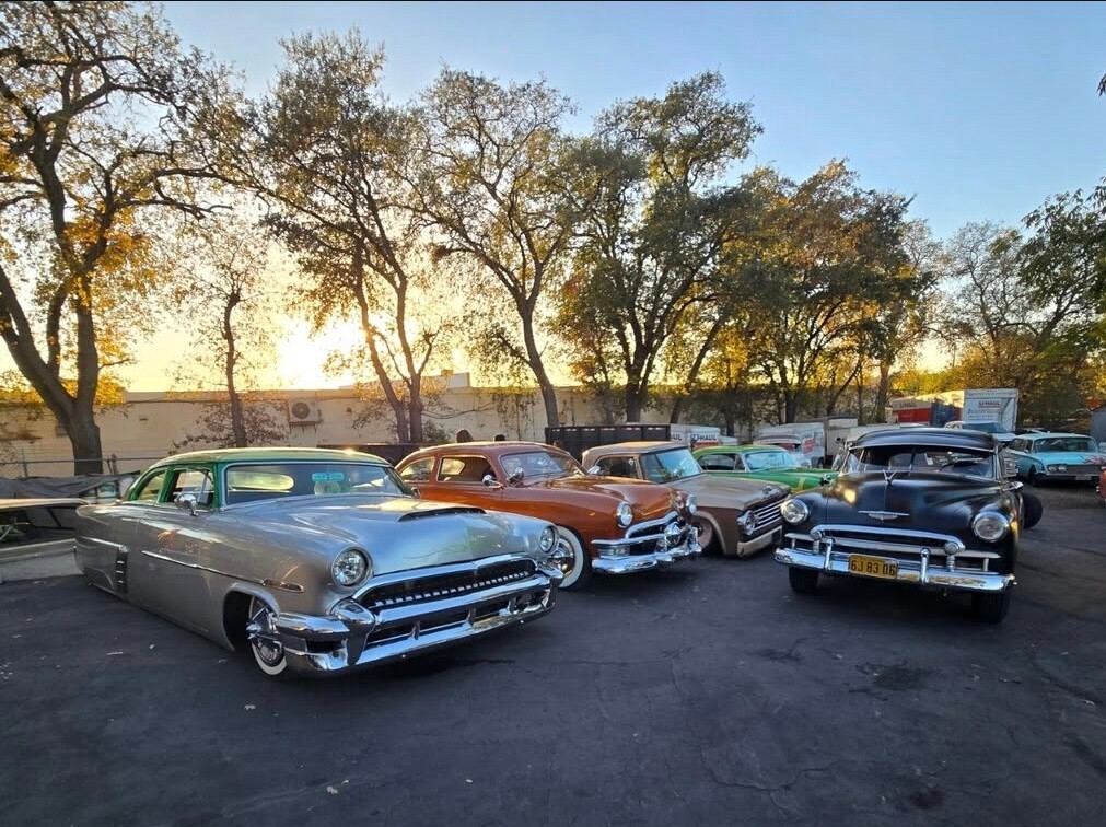 A row of colorful customs beneath the evening sky